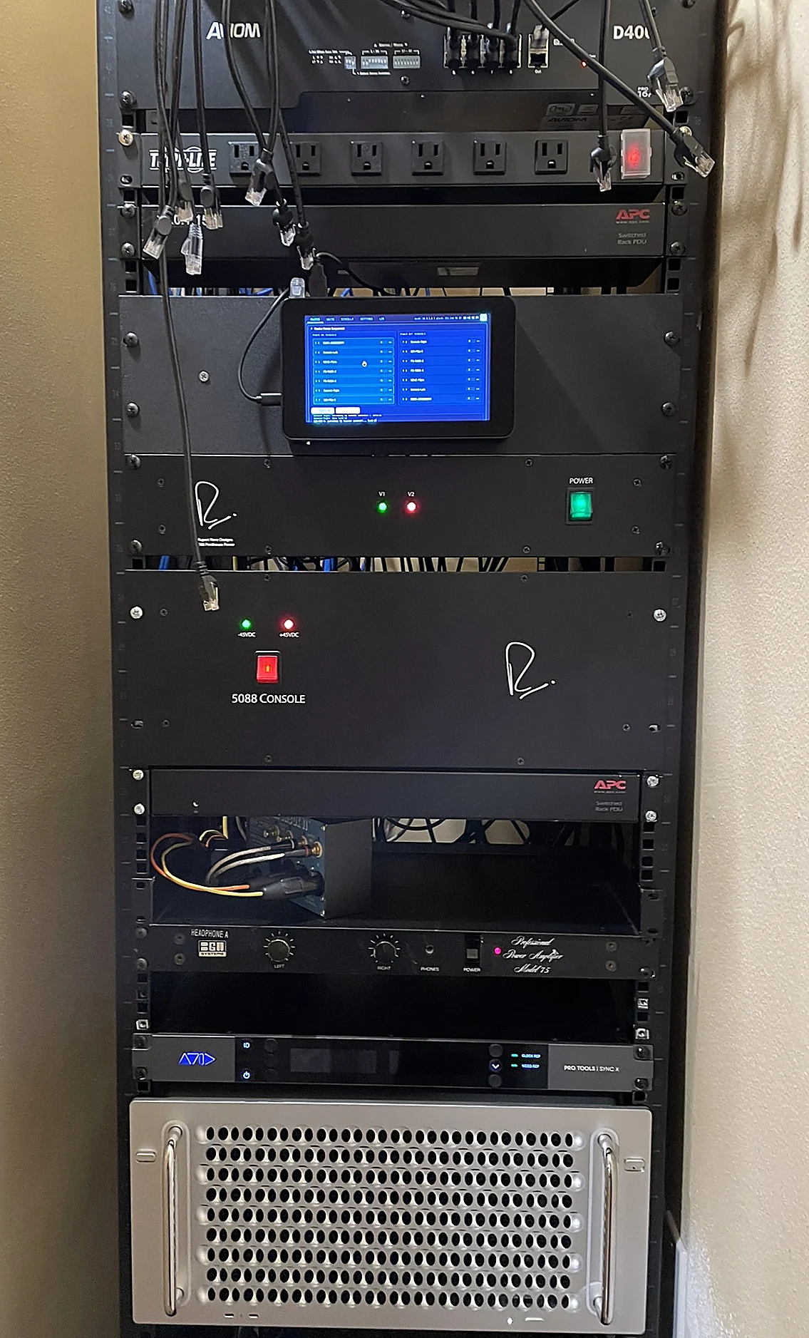 Installed Raspberry Pi touchscreen controller beside a rack
